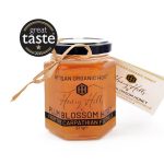 Golden jar of Pure Rare Plum Blossom Honey, showcasing its rich color and artisanal packaging, perfect for gourmet cooking or indulgent spreads.